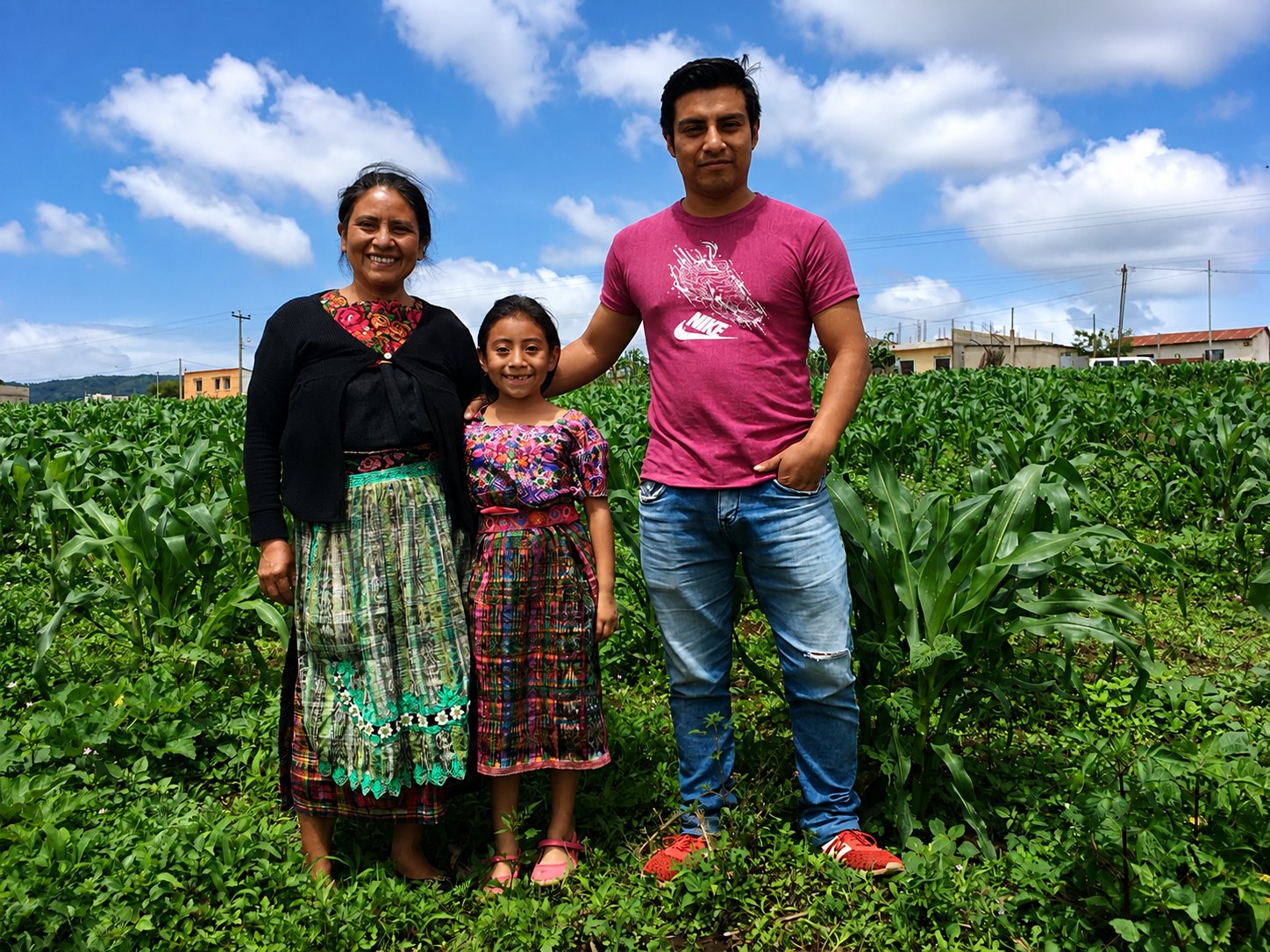 A YAPU loan officer working with a client in the field